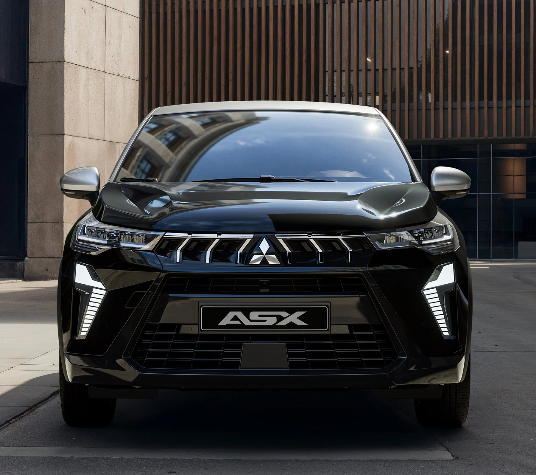 A frente do Novo Mitsubishi ASX Black Edition, com a grelha Dynamic Shield e a assinatura luminosa em T invertido